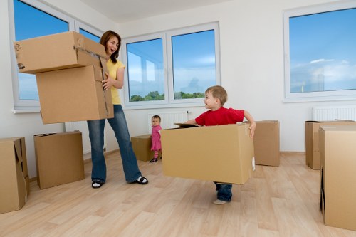 Removal team handling furniture during a Hornchurch house move